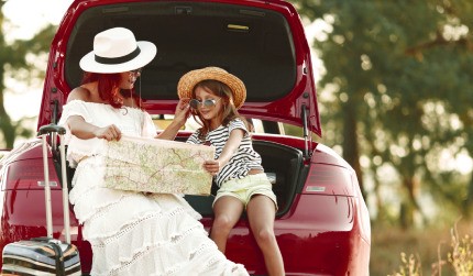 A woman and her child are preparing for family travel.