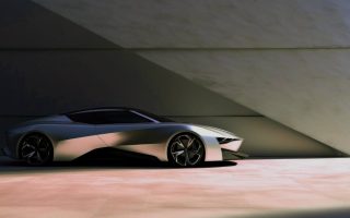A new gray future car in front of a wall