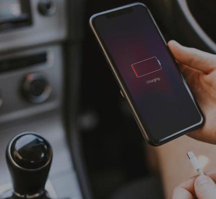 Phone is charging by items for comfortable driving