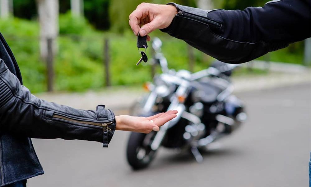 A man successfully performs the best way to sell a motorcycle